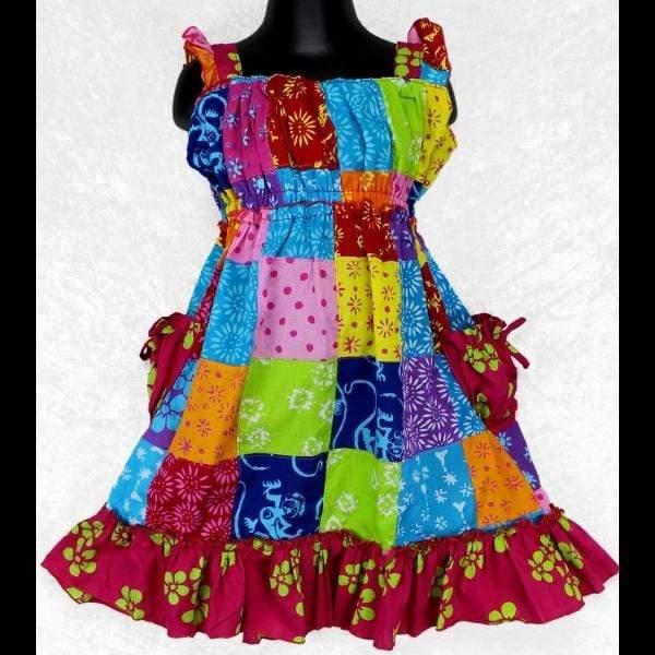 https://peacefulpeople.com/cdn/shop/products/wholesale_girls_patchwork_dress_ruffles_pockets_elastic_waist_bright_colors_cotton_2048x.jpg?v=1657055135